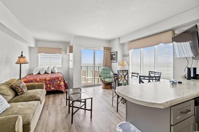 Bedroom featuring access to exterior and light wood-style floors