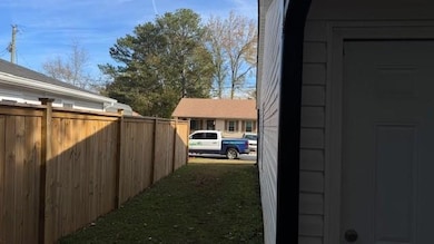 View of yard featuring fence