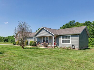 THIS BEAUTIFUL HOME SITS ON OVER 1 ACRE