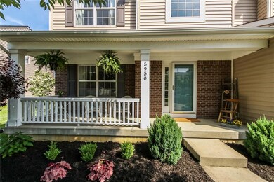 You'll love relaxing on the shaded front porch. 