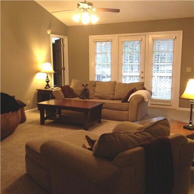 Spacious Den with french doors leading onto the deck.