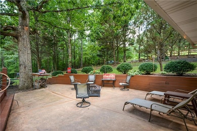 View of patio featuring an outdoor fire pit