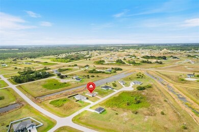 Birds eye view of property featuring a rural view