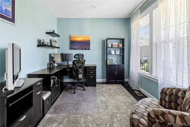 Office with glass French doors, recessed lighting,