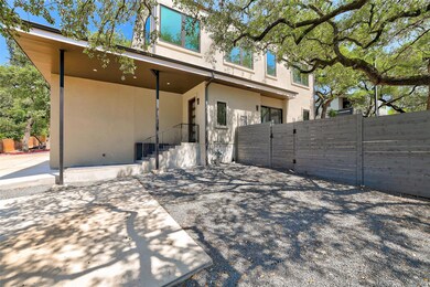 Rear view of property with stucco siding and a pa
