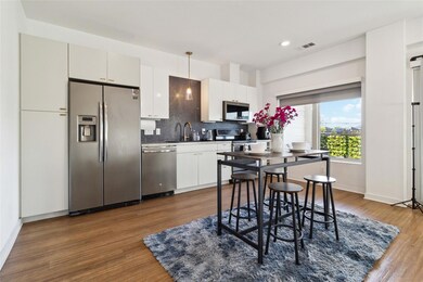 Kitchen with stainless steel appliances, a sink, 