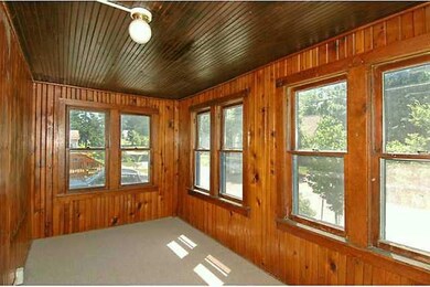 Other. Enclosed front porch has knoot pine finish 