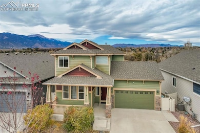 Front Exterior (Alternate View) – A closer look at the welcoming entry and porch area, showcasing the home’s attractive trim details and warm color palette.