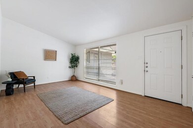 Entryway with baseboards, wood finished floors, a