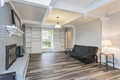 COZY INTO YOUR DEN WITH A WOOD BURNING FIREPLACE AND BUILT INS! THE CEILING DETAILED FEATURES WARMS THE ROOM EVEN MORE!