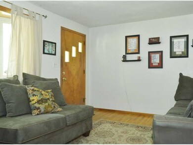Living Room. The home features hardwood floors in 