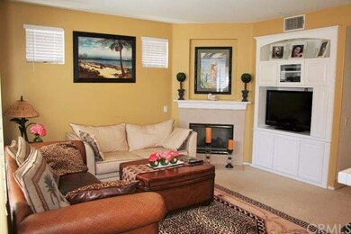 Kitchen opens to Family Room with built-in cabinet