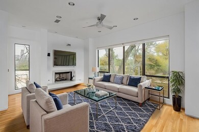 Living room with recessed lighting, a fireplace wi