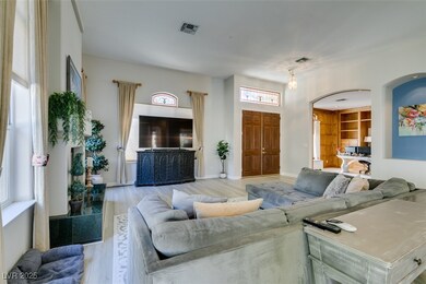 Living area with light wood-style floors, baseboar