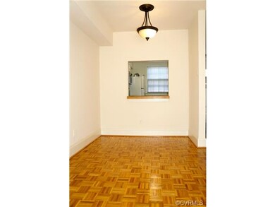 Dining area with updated light fixture and pass-th