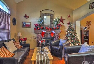 Living room, hardwood floors, fireplace adjacent t