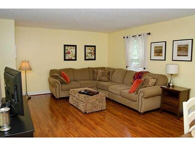 Living Room. Gleaming floors will work with any de