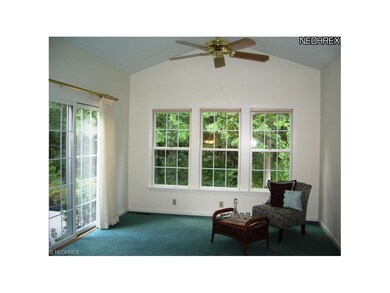 Vaulted Sunroom with sliding doors to two patios a