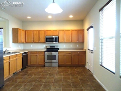 Large kitchen on the main level with decorative li