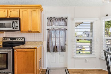 Kitchen with appliances with stainless steel finis