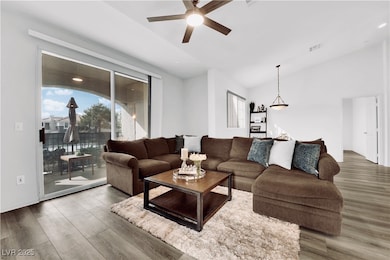 Living area featuring wood finished floors, a ceil