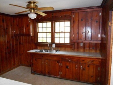 The kitchen has plenty of natural lighting and a n