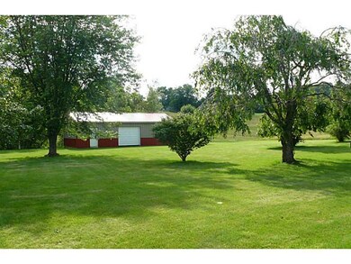 Stable/Barn. Pole Barn with garage door and man do
