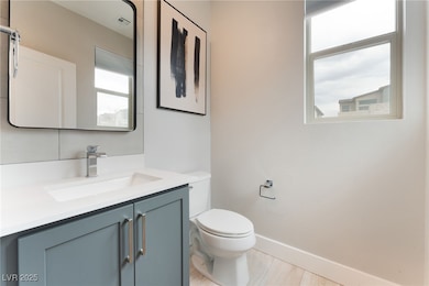 Bathroom featuring toilet and vanity