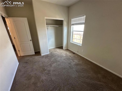 Unfurnished bedroom featuring baseboards, visible 