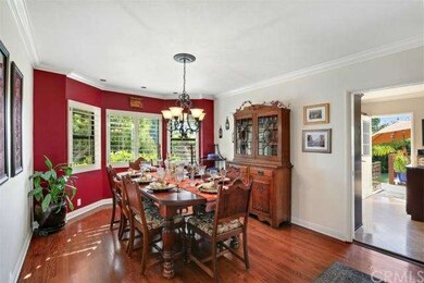 Formal dining room is warm and inviting with bay w