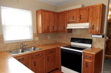 Kitchen with breakfast nook, dishwasher, oven, ele