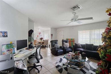 Office space with light tile patterned floors and