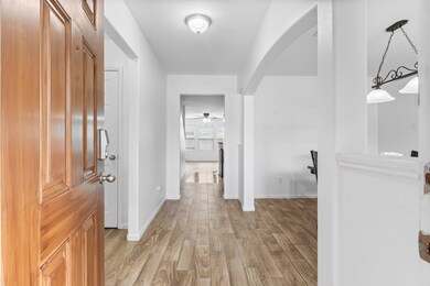 Welcome to a bright and inviting entryway featurin