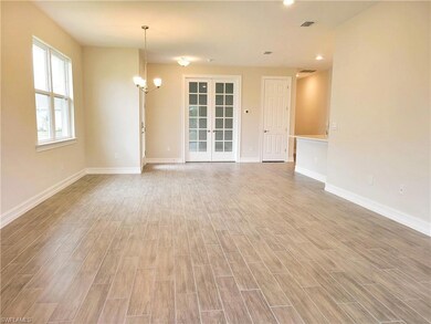 Unfurnished room featuring an inviting chandelier,