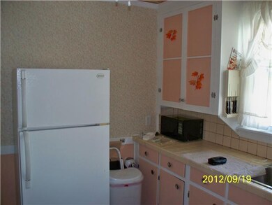 Kitchen. Upper unit: Refrigerator included in sale