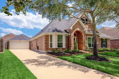 Be welcomed by fabulous curb appeal with a traditional brick elevation, handsome coach lights, and an impressive covered entry surrounded by mature landscaping. You’ll find ample off-street parking for you and your guests in the two-car detached garage and extended driveway.