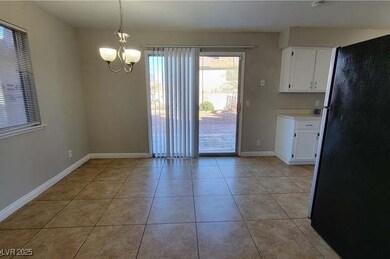 Unfurnished dining area featuring light tile patte
