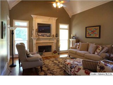 Keeping room with vaulted ceilings and fireplace -