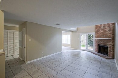 Living room with double doors to covered patio at 