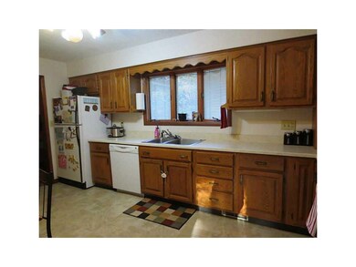 Kitchen. Lots of sunlight streaming through the wi