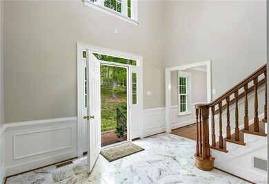 2-story foyer with marble floor.