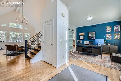 Entryway with crown molding, light hardwood / wood
