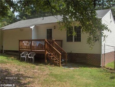 Exterior Back - Freshly stained deck, vinyl siding