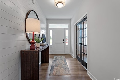 Foyer featuring wood finished floors