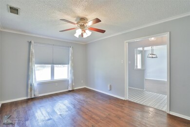 Unfurnished room featuring ceiling fan, hardwood /