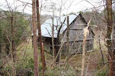 Beautiful barn across street Winter
