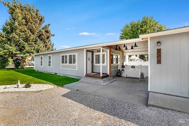 Single story home featuring a front lawn