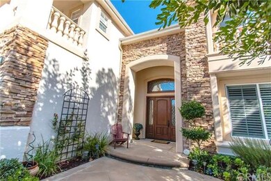 The Elegantly Arched Entrance Way will warmly welc