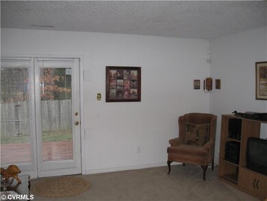 Living Room - Large, open and bright is the only way to describe the living room that opens into large fenced in rear yard with a deck platform.
