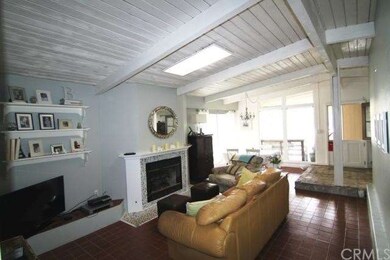 Living room with gorgeous vaulted wood beam ceilin